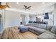 Open concept living room with a large gray sectional sofa and views to kitchen at 805 Tirzah Rd, York, SC 29745
