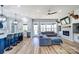 Spacious open-concept living room features a fireplace, kitchen with an island, and ample windows at 805 Tirzah Rd, York, SC 29745