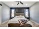 Serene main bedroom featuring a decorative accent wall, wood-look flooring, and ample natural light at 805 Tirzah Rd, York, SC 29745