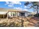 A view of the home's backyard featuring a patio and screened porch at 9005 Smokey Hill Ln, Indian Land, SC 29707
