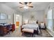 Comfortable bedroom with a cozy bed, adjacent to a study area and ensuite bathroom at 9005 Smokey Hill Ln, Indian Land, SC 29707