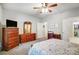Spacious bedroom layout with generous dresser storage, desk, and walk-in closet access at 9005 Smokey Hill Ln, Indian Land, SC 29707