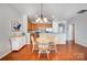 Inviting dining area features stylish chandelier and complements kitchen's wood cabinets and granite countertops at 9005 Smokey Hill Ln, Indian Land, SC 29707