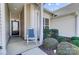 Charming front porch with rocking chair, neat landscaping, and elegant front door at 9005 Smokey Hill Ln, Indian Land, SC 29707