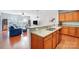 Open-concept kitchen featuring granite countertops, stainless steel appliances, and hardwood floors at 9005 Smokey Hill Ln, Indian Land, SC 29707