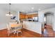 Bright kitchen with wooden cabinets, stainless steel appliances, and an adjacent dining area at 9005 Smokey Hill Ln, Indian Land, SC 29707