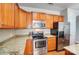Well-equipped kitchen with stainless steel appliances, granite countertops, and ample wood cabinetry at 9005 Smokey Hill Ln, Indian Land, SC 29707