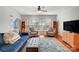 Comfortable living room with hardwood floors, plush seating, and natural light from large windows at 9005 Smokey Hill Ln, Indian Land, SC 29707