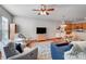 Open concept living space includes plush armchairs, hardwood floors, and open access to kitchen at 9005 Smokey Hill Ln, Indian Land, SC 29707