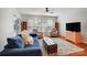 Bright living room with hardwood floors, plush seating, and ample natural light from the windows at 9005 Smokey Hill Ln, Indian Land, SC 29707