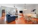 Inviting living area showcases hardwood floors, a modern TV, and seamlessly connects to the dining space at 9005 Smokey Hill Ln, Indian Land, SC 29707