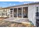 Screened in porch with ceiling fan and outdoor seating for relaxing afternoons at 9005 Smokey Hill Ln, Indian Land, SC 29707