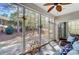Enjoy nature from this cozy screened porch, featuring a ceiling fan and sliding door to the home's interior at 9005 Smokey Hill Ln, Indian Land, SC 29707