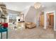 Bright bonus room featuring carpeted floors, large windows, and a charming chandelier at 9260 Ahavah Ln, Indian Trail, NC 28079