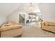 Spacious bonus room with carpeted floors, decorative shelves, and ample natural light at 9260 Ahavah Ln, Indian Trail, NC 28079
