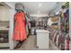 Walk-in closet with custom shelving, hanging rods, and ample storage space at 9260 Ahavah Ln, Indian Trail, NC 28079