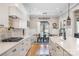 The dining room is open to the kitchen, features a large window and a rustic wooden table at 9260 Ahavah Ln, Indian Trail, NC 28079