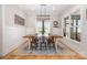 Dining room features a large window and a rustic wooden table, bathed in natural light at 9260 Ahavah Ln, Indian Trail, NC 28079