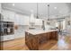 Gourmet kitchen with large island, modern appliances, and stylish finishes perfect for culinary enthusiasts at 9260 Ahavah Ln, Indian Trail, NC 28079