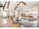 Open-concept living area with hardwood floors, comfortable seating, and views into the kitchen at 9260 Ahavah Ln, Indian Trail, NC 28079
