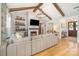 Cozy living room with exposed beams, fireplace, and open floor plan for a relaxed and inviting atmosphere at 9260 Ahavah Ln, Indian Trail, NC 28079