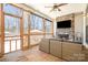 Covered patio with a stone fireplace and a view of the backyard at 9260 Ahavah Ln, Indian Trail, NC 28079