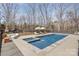 Beautiful pool with surrounding lounge furniture, hot tub and access to play area at 9260 Ahavah Ln, Indian Trail, NC 28079