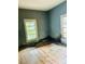 Bedroom features hardwood floors and natural lighting with two windows at 981 15Th St # 16, Lancaster, SC 29720