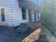 An exterior elevation showing the entrance to a property featuring a small porch and concrete steps at 981 15Th St # 16, Lancaster, SC 29720