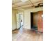 Living room needing full renovation, with original hardwood flooring and open doorways at 981 15Th St # 16, Lancaster, SC 29720