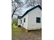 Exterior side view of the house, showcasing the siding, windows, and backyard at 981 15Th St # 16, Lancaster, SC 29720