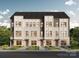 Attractive new construction townhome with white brick, gray siding, and manicured landscaping at Lot 33 Old Pineville Rd, Charlotte, NC 28217