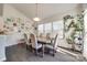 Sun-lit dining room featuring a large window, seating for six, and charming decor, creating a cozy atmosphere at 10379 Black Locust Ln, Charlotte, NC 28215