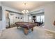Versatile game room with space for a pool table and an adjacent home office at 10379 Black Locust Ln, Charlotte, NC 28215