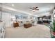 Large living room with plush seating, a cozy fireplace, and an open view to the modern kitchen, perfect for gatherings at 10379 Black Locust Ln, Charlotte, NC 28215