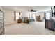 Expansive main bedroom featuring neutral walls, a ceiling fan, and ample space for furniture at 10379 Black Locust Ln, Charlotte, NC 28215