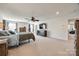 Bright and airy main bedroom with a TV, walk-in closet, and adjacent bathroom, perfect for relaxation at 10379 Black Locust Ln, Charlotte, NC 28215