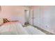 Pink bedroom featuring carpet floors and two closets at 1076 Westminster Dr, Lancaster, SC 29720