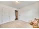 Bedroom with carpet flooring, a rocking chair, and a closet at 1076 Westminster Dr, Lancaster, SC 29720