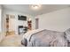 Bedroom featuring an ensuite bathroom, walk-in closet, and a wall-mounted TV at 1076 Westminster Dr, Lancaster, SC 29720