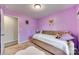 Bedroom with purple walls, carpet floors, and a twin sized bed at 1076 Westminster Dr, Lancaster, SC 29720