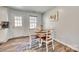 Cozy dining nook with neutral paint, wood floors and updated furniture at 1076 Westminster Dr, Lancaster, SC 29720