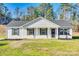 Inviting front exterior of home with well-manicured lawn and neutral colored siding at 1076 Westminster Dr, Lancaster, SC 29720