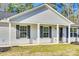 Charming front porch with black shutters, white columns, and a welcoming entrance at 1076 Westminster Dr, Lancaster, SC 29720