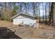 Detached garage with ample storage space and a large driveway, perfect for parking and projects at 1120 Crestview Ave, Salisbury, NC 28144