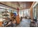 Enclosed sunroom with stone floors, lots of windows, and potential for customization at 1120 Crestview Ave, Salisbury, NC 28144