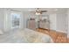 Bright bedroom with wood floors, dresser, and a large window with natural light at 1201 Edgefield Ave, Gastonia, NC 28052