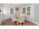 Bright dining area with a glass-top table, four chairs, and natural light at 1201 Edgefield Ave, Gastonia, NC 28052