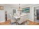 Elegant dining room with a marble-top table and six upholstered chairs at 1201 Edgefield Ave, Gastonia, NC 28052