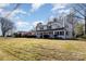Charming two-story home with a welcoming front porch and well-maintained landscaping on a sprawling lawn at 1201 Edgefield Ave, Gastonia, NC 28052
